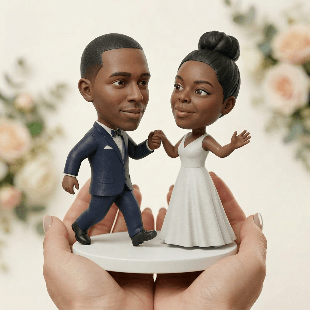 Finished 3D printed cake topper of couple 2 held in hand